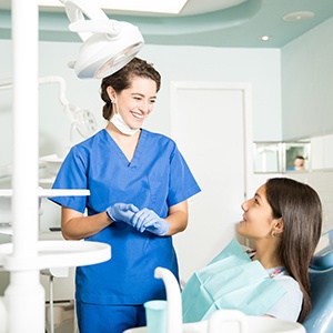 Patient in Raleigh talking to dentist about dental implants
