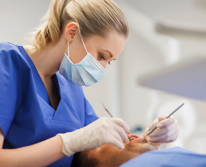 Dentist giving a patient a preventive dentistry checkup