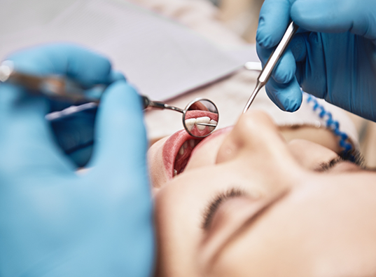 Close up of a patient receiving a dental exam